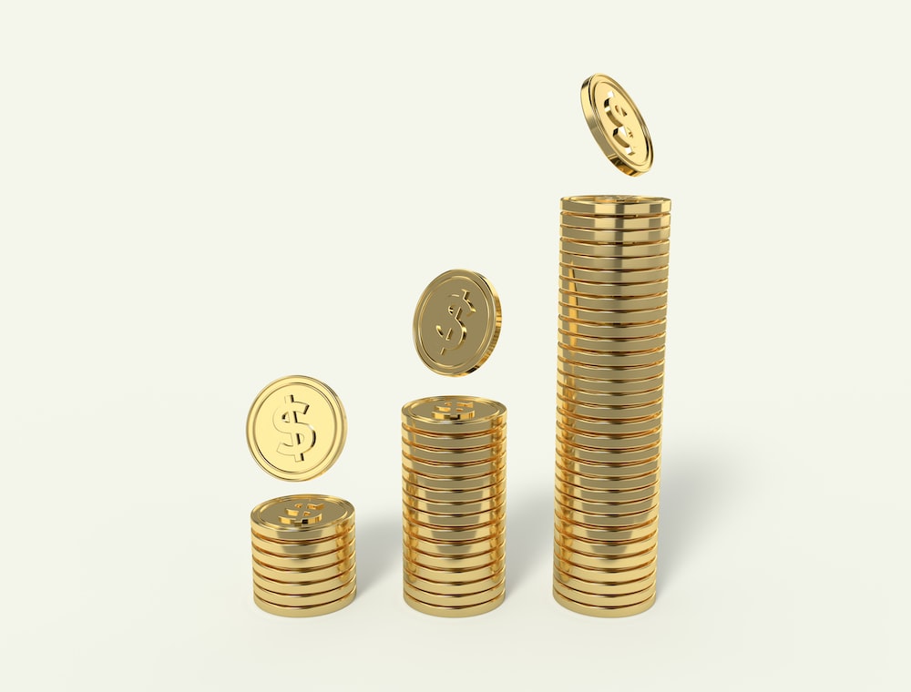 Computer-generated Image of Three Coin Stacks, Each Taller Than the One Before, Symbolizing Real Estate Investment Profits