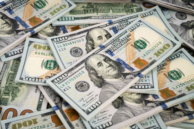 An image of 100 US dollar banknotes