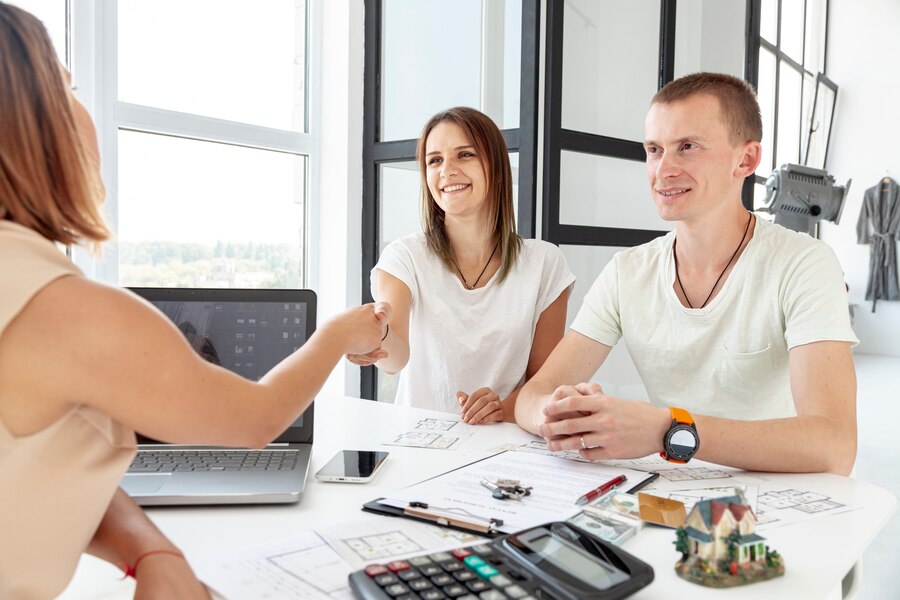 a couple during a business meeting with a hard money lender seeking investment loan