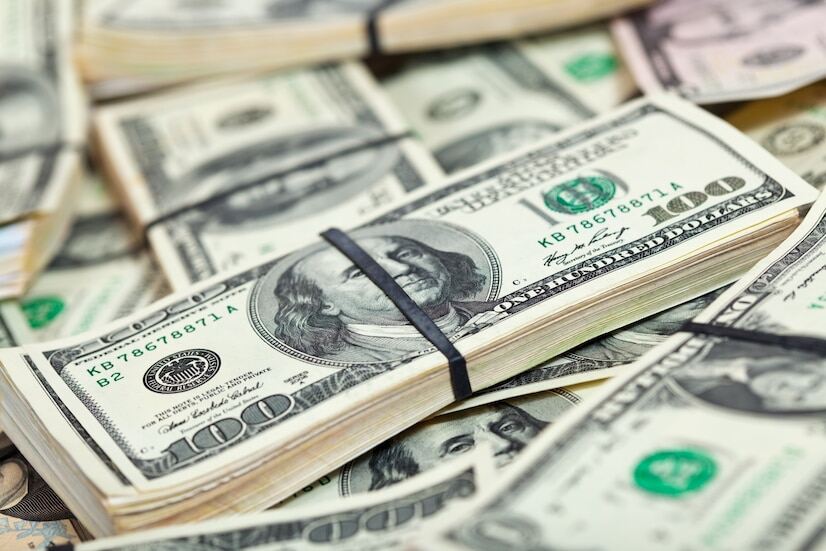 A closeup image of bundles of 100 US dollar banknotes