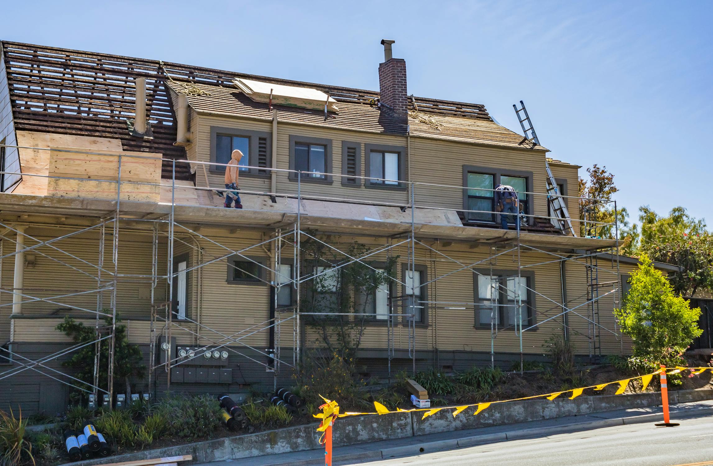 Workers constructing a house