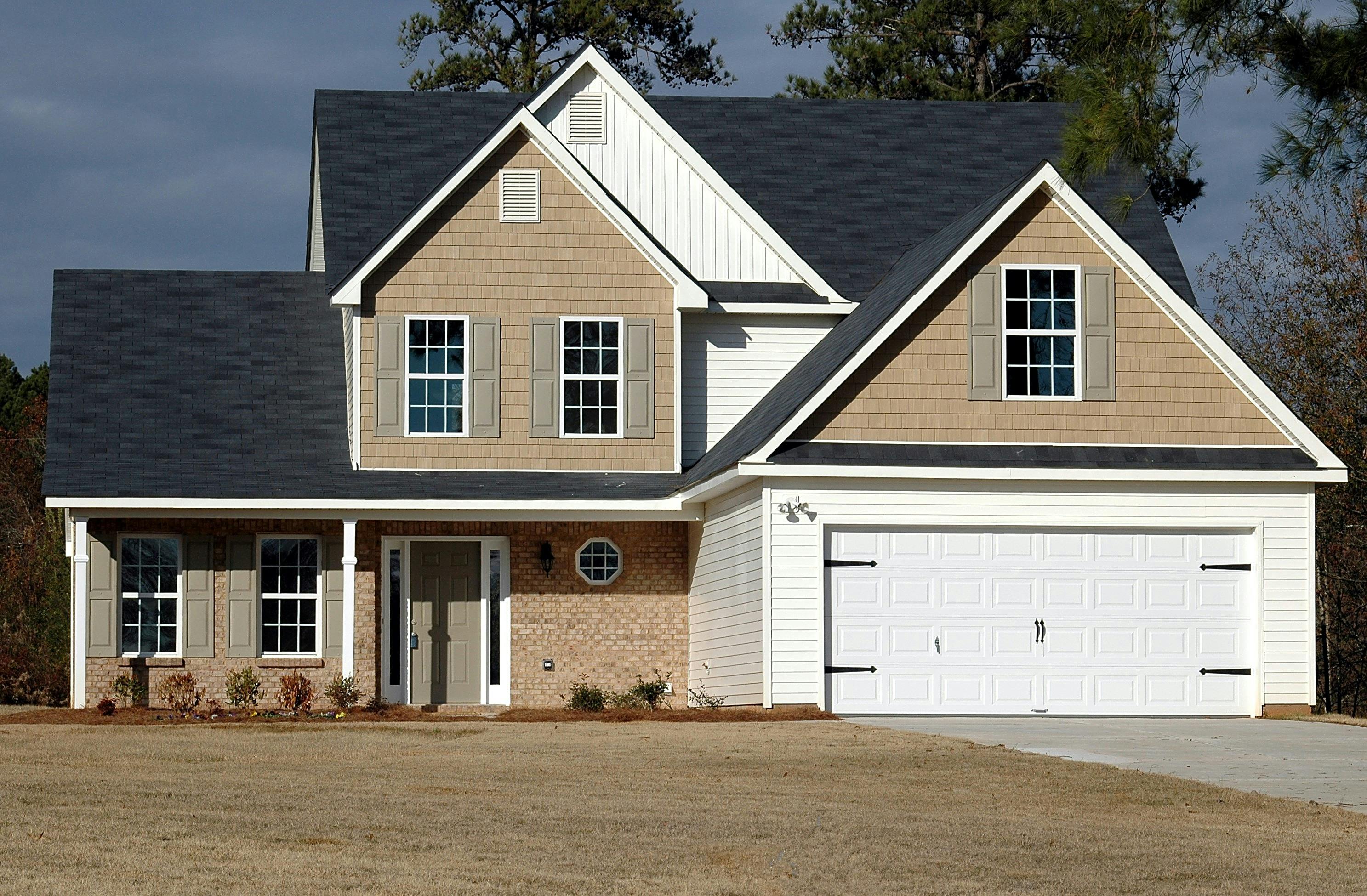 A brown, grey, and white house