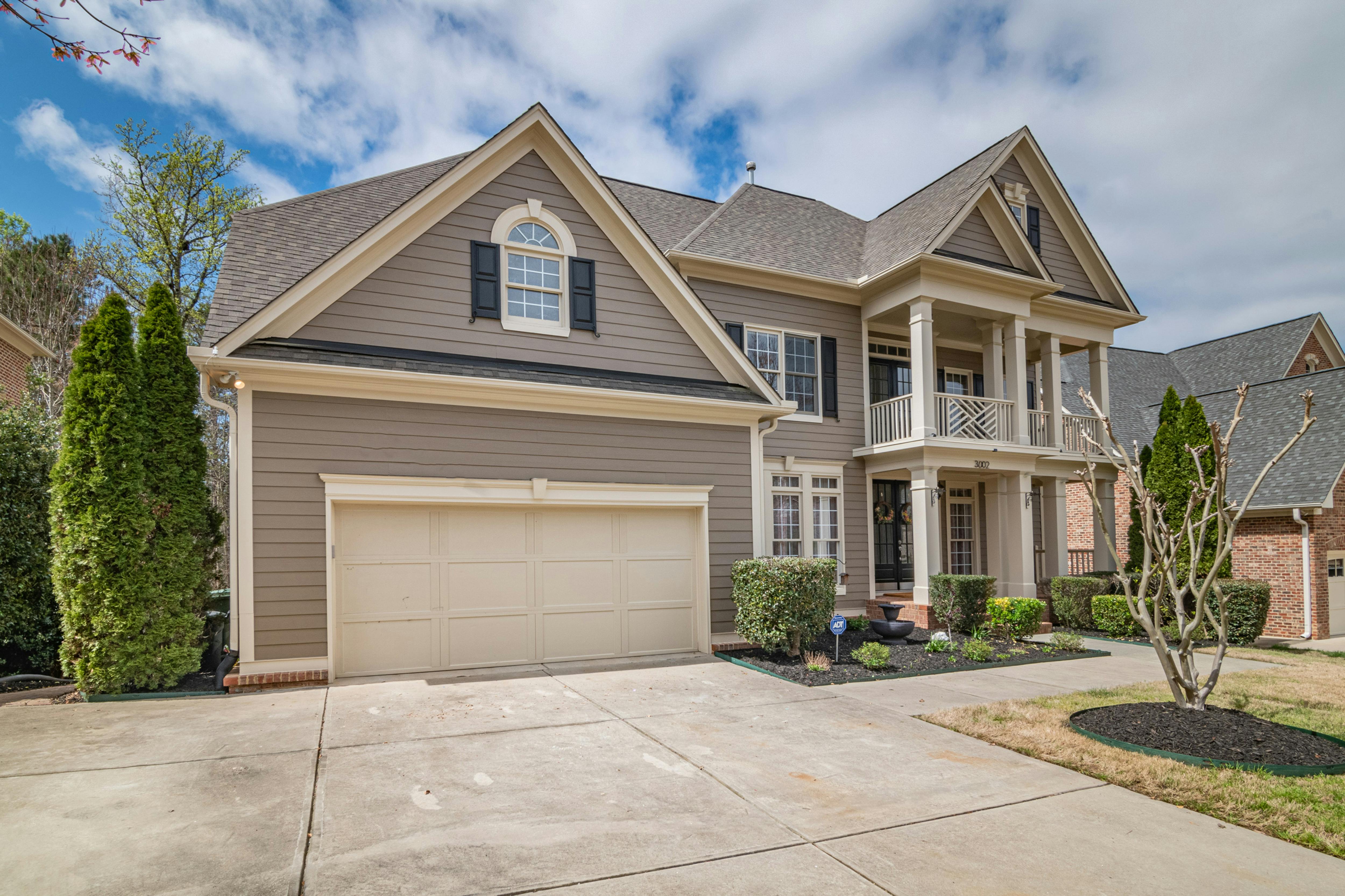 A greyish-brown real estate house