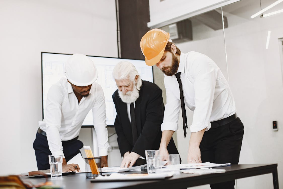 An image of people working in an office and looking over bridge loan documents