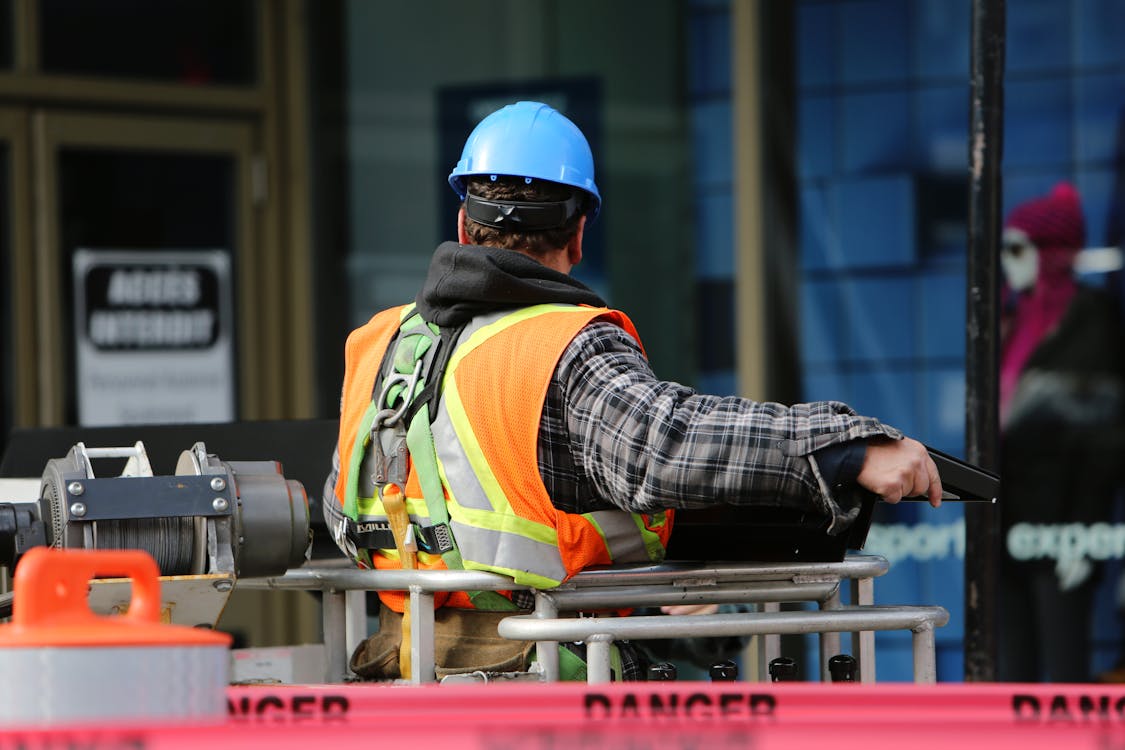 An image of a man wearing a blue helmet
