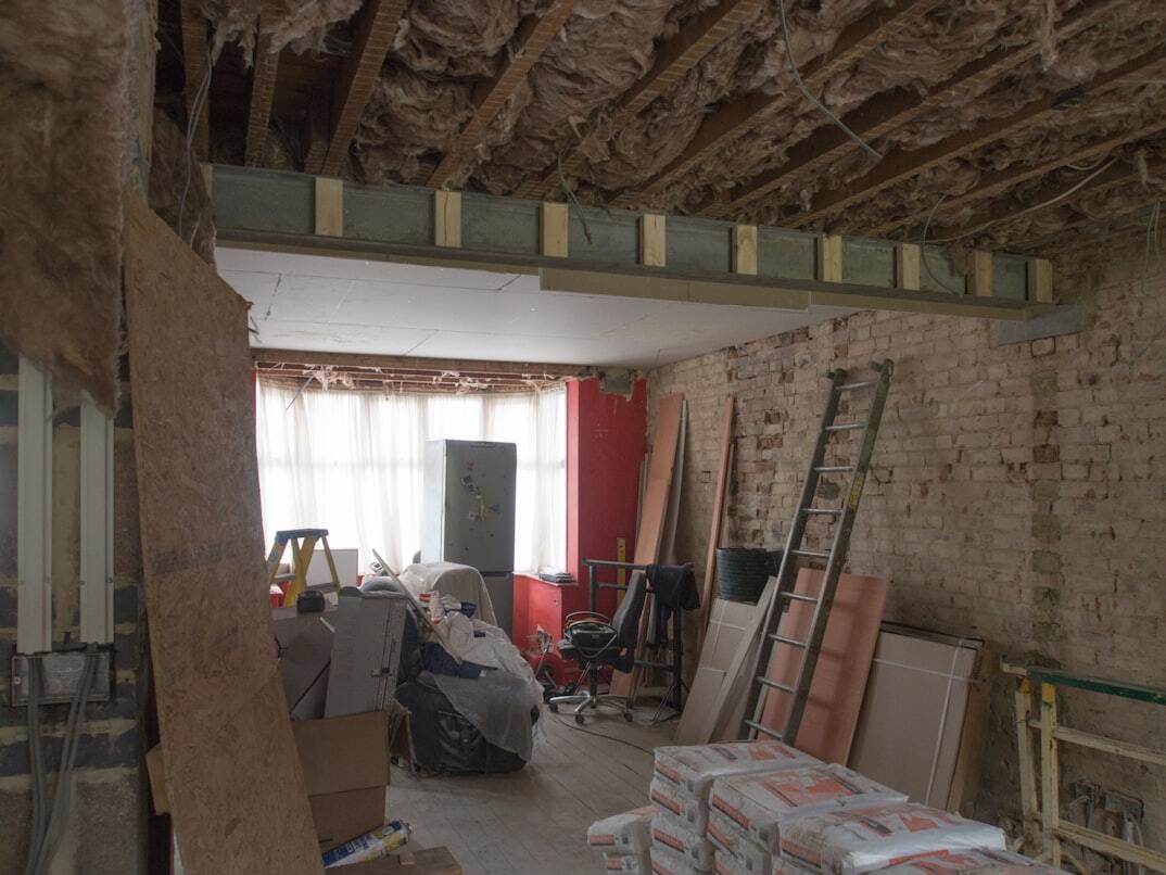 A room filled with boxes and renovation tools
