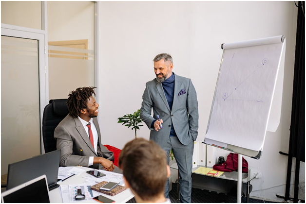 a fix and flip financing expert discussing loan terms with an investor