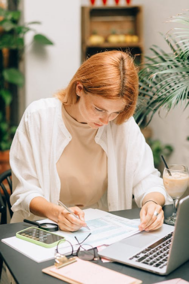 a woman identifying mistakes on her credit report
