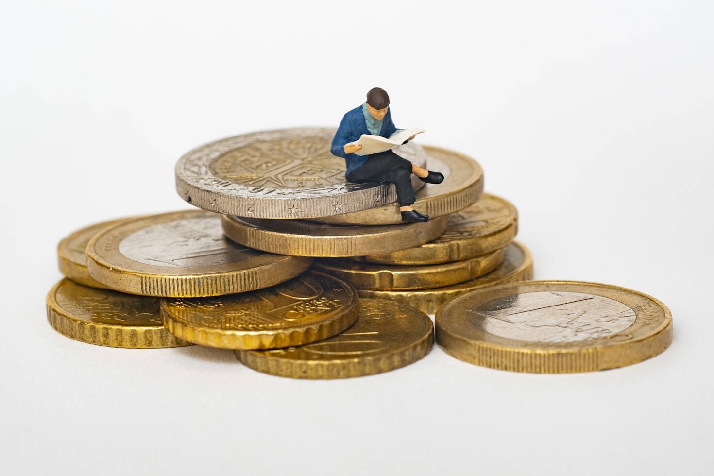 person sitting on gold coins