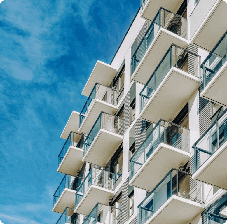 Modern student apartment building with balconies, suitable for university housing.