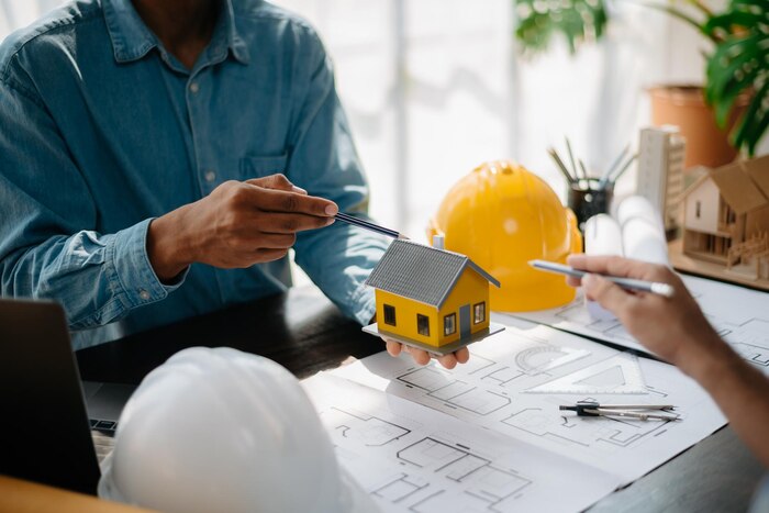 real-estate-broker-agent-presenting-consult-customer-decision-making-sign-insurance-form-agreement-home-model-concerning-mortgage-loan-offer-i_533878-844