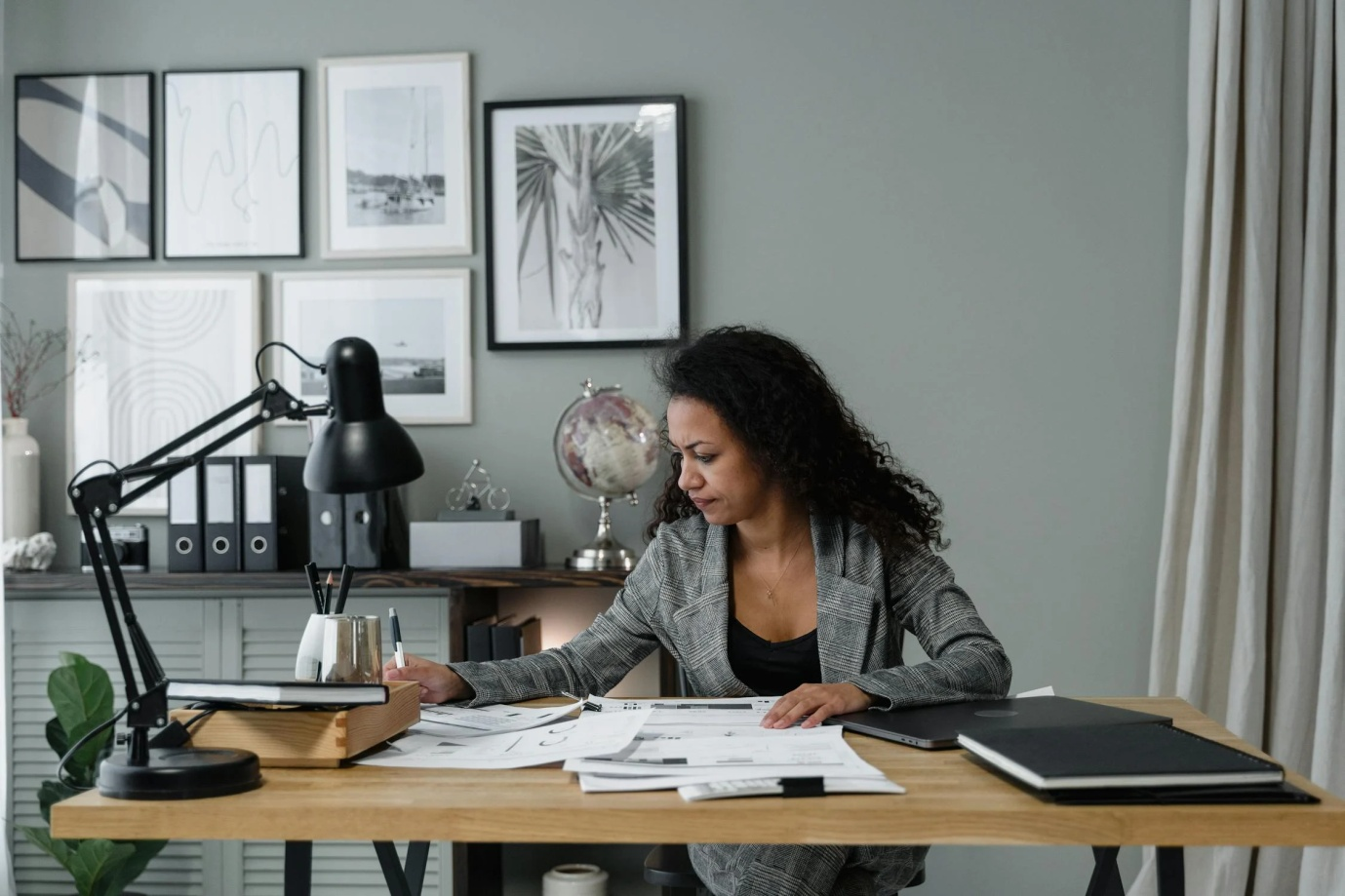 real-estate-investor-planning-multi-family-bridge-loan-strategy-desk-paperwork-pen