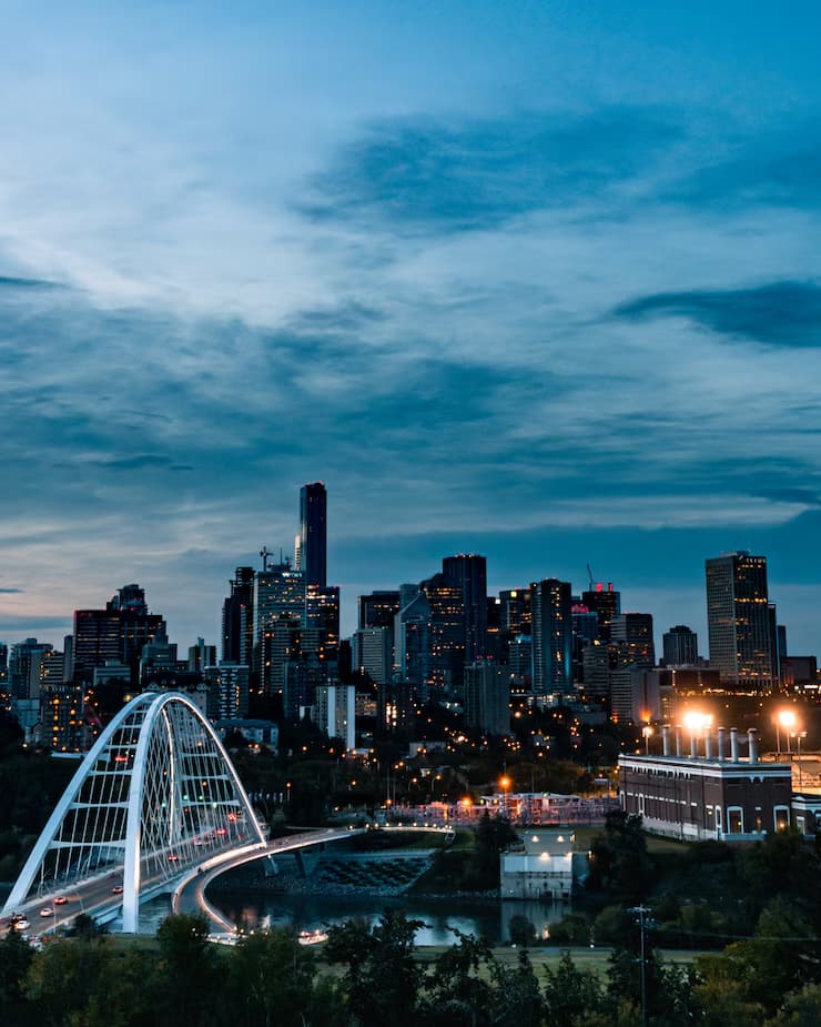 vertical-shot-busy-city-reflecting-river_181624-8095
