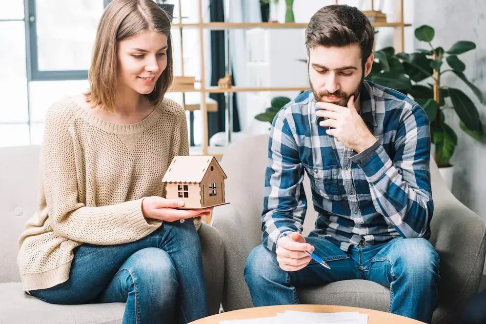 young-couple-thinking-mortgage_23-2147797653 young-couple-thinking-mortgage_23-2147797653
